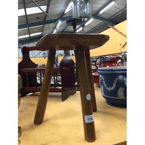 1086 - A VINTAGE OAK THREE LEGGED MILKING STOOL