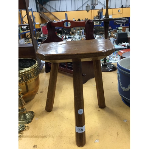 1086 - A VINTAGE OAK THREE LEGGED MILKING STOOL