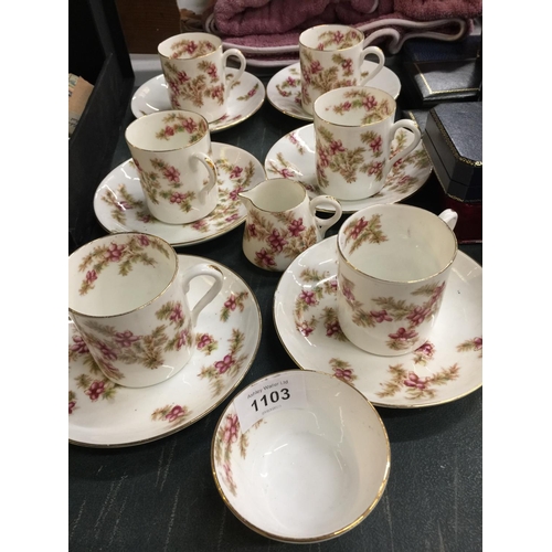 1103 - AN ANTIQUE TEA SET WITH FLORAL PATTERN TO INCLUDE CUPS, SAUCERS, A CREAM JUG AND SUGAR BOWL