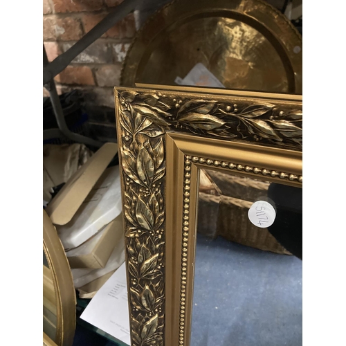 1107 - A BEVELLED EDGED GILT FRAMED WALL MIRROR 87CM X 61CM