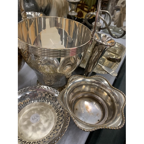 136 - A QUANTITY OF SILVER PLATED ITEMS TO INCLUDE ROSE BOWLS, A CANDLEABRA, BUD VASES, A HANDLED SERVING ... 