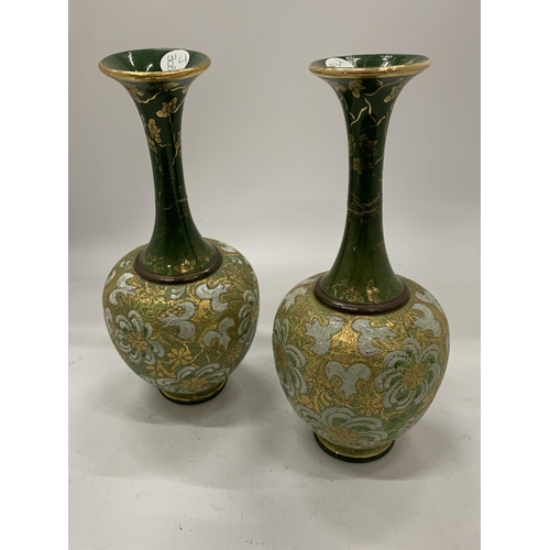 149 - A PAIR OF ROYAL DOULTON VASES WITH SLIM NECKS AND GREEN PATTERN - BOTH A/F