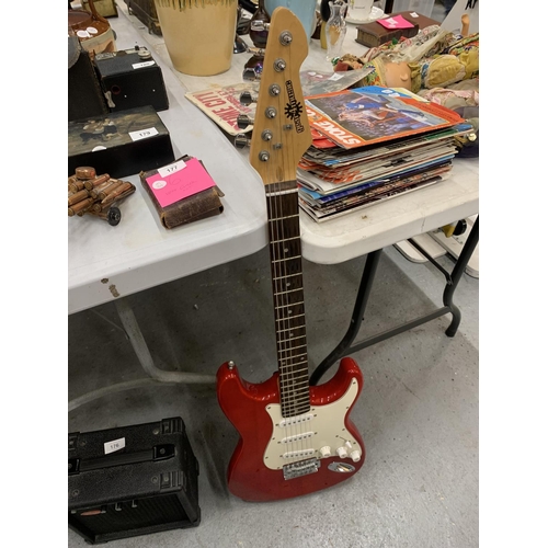 175 - A 'GEAR4MUSIC' RED ELECTRIC GUITAR & A STAGG ELECTRIC AMPLIFIER