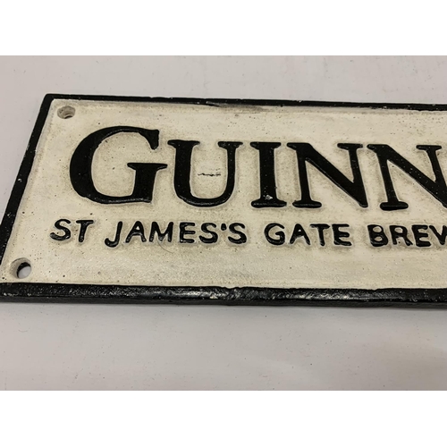 195 - A CAST GUINNESS SIGN 39CM X 10CM