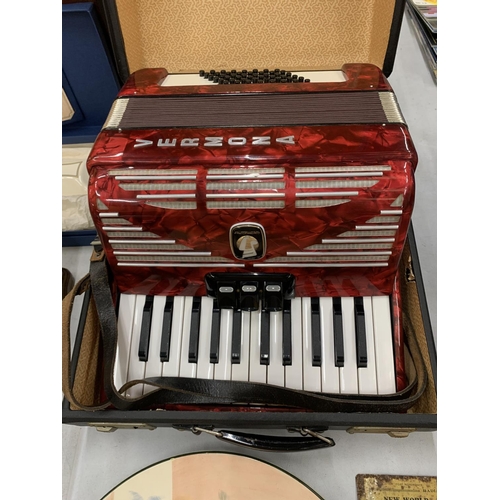 232 - A STUDENTS VERMONA WEITMEISTER RED ACCORDIAN IN A CASE