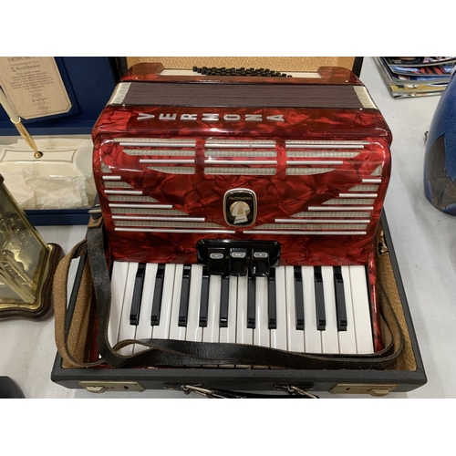 232 - A STUDENTS VERMONA WEITMEISTER RED ACCORDIAN IN A CASE