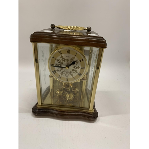 235 - A WOOD AND GLASS CASED ANNIVERSARY CLOCK MADE BY ACCTIM