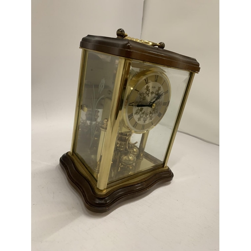 235 - A WOOD AND GLASS CASED ANNIVERSARY CLOCK MADE BY ACCTIM