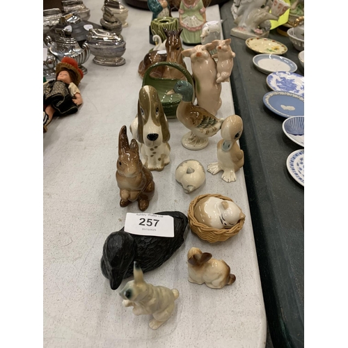 257 - A QUANTITY OF CERAMIC ANIMAL FIGURES TO INCLUDE RABBITS, CATS, DUCKS, A HORSE, GOAT, ETC PLUS TWO AR... 