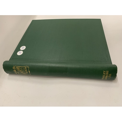 274 - A GREEN LEATHER STAMP ALBUM CONTAINING BRITISH STAMPS