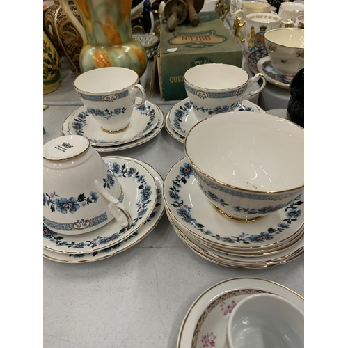 291 - A QUANTITY OF CHINA CUPS AND SAUCERS PLUS A SUGAR BOWL