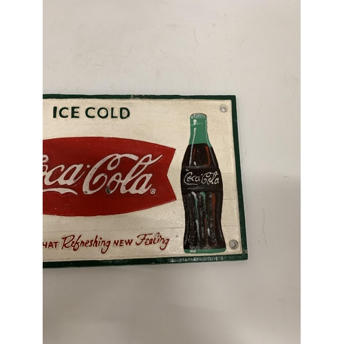 293 - A CAST 'ICE COLD COCA-COLA' SIGN 29CM X 20CM