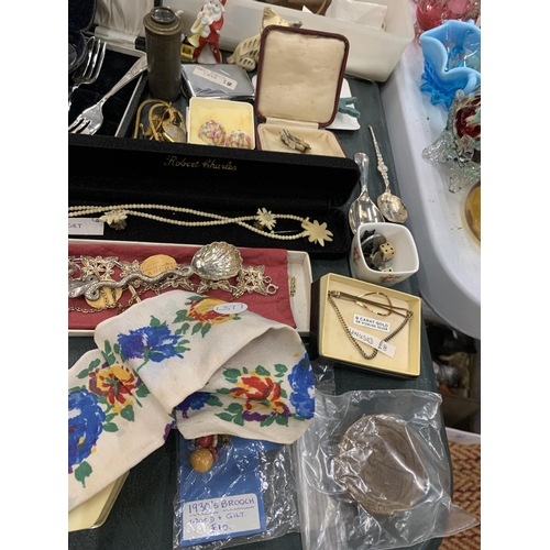 297 - A LARGE MIXED LOT TO INCLUDE COSTUME JEWELLERY, FIGURES, FLATWARE, AN ART DECO CARD CASE, ETC