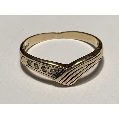 530 - A 9 CARAT GOLD WISHBONE RING WITH FOUR DIAMONDS SIZE M