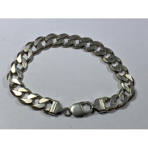 667 - A MARKED SILVER HEAVY FLAT LINK BRACELET