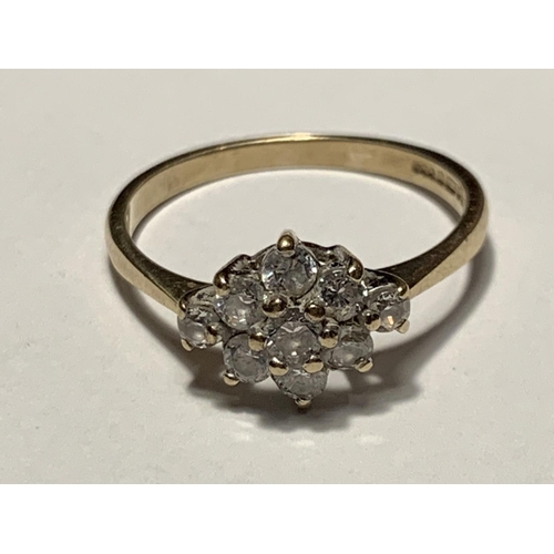 672 - A 9 CARAT GOLD CLUSTER RING WITH CUBIC ZIRCONIA STONES SIZE M/N