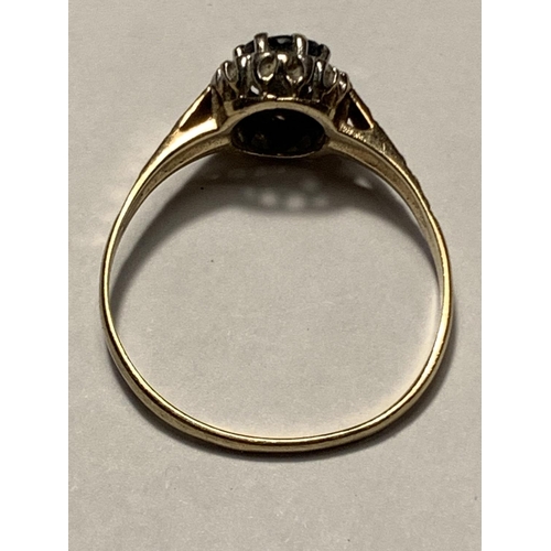 674 - A 9 CARAT GOLD RING WITH A CENTRE SAPPHIRE SURROUNDED BY DIAMONDS SIZE SIZE Q