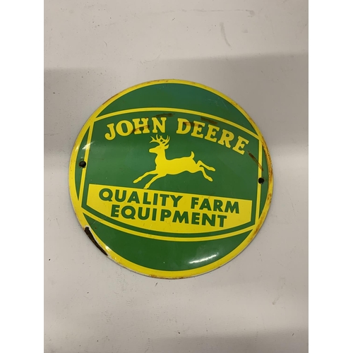 68 - A SMALL JOHN DEERE CIRCULAR ENAMEL SIGN, DIAMETER 15CM