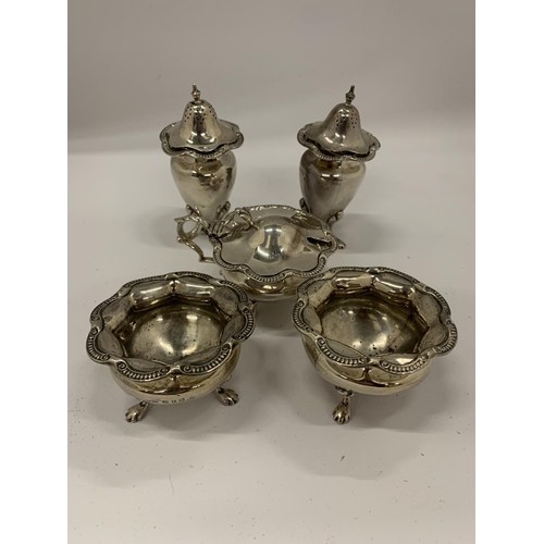 7 - A BIRMINGHAM HALLMARKED SILVER FIVE PIECE CONDIMENT SET COMPRISING TWO OPEN SALTS, MUSTARD POT AND S... 