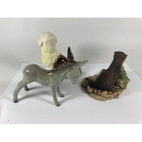 724 - THREE ANIMAL FIGURINES TO INCLUDE A GOEBEL OLD ENGLISH SHEEP DOG, A MIDWINTER DONKEY AND A BORDER FI... 