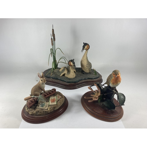 731 - THREE BORDER FINE ARTS FIGURES ON PLINTHS TO INCLUDE GREAT CRESTED GREBES, THE GARDNER RABBIT AND A ... 