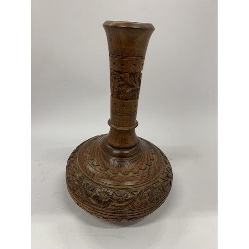 82 - A VINTAGE CARVED WOODEN INDIAN VASE, HEIGHT 23CM