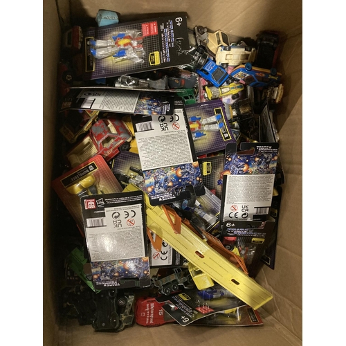 823 - A LARGE QUANTITY OF TRANSFORMERS IN BLISTER PACKS, DIECAST VEHICLES ETC