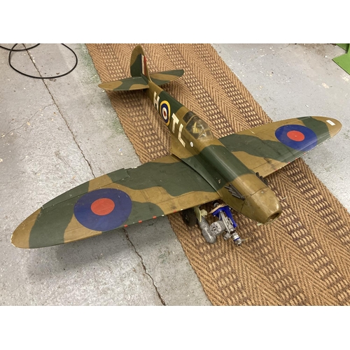 843 - A LARGE MODEL OF A SPITFIRE PLANE LENGTH 103CM