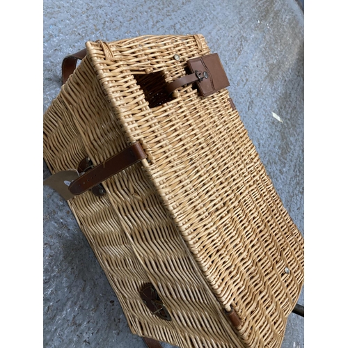 917 - AN ANTLER WICKER PICNIC BASKET WITH ACCESSORIES