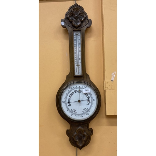 995 - A VINTAGE MAHOGANY BAROMETER WITH CARVING TO TOP AND BOTTOM