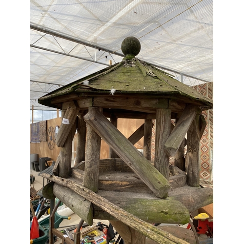 1860 - A LARGE WOODEN BIRD TABLE