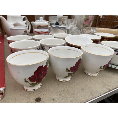 1949 - AN ASSORTMENT OF CERAMIC ITEMS TO INCLUDE CUPS, TEAPOTS AND JUGS ETC