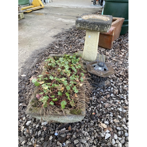 2001 - A RECONSTITUTED STONE BIRD BATH AND PLANTER AND A CAST METAL CANDLE LANTERN