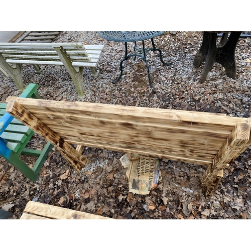 2009 - A WOODEN SLATTED GARDEN BENCH WITH PAINTED STAG BACKGROUND