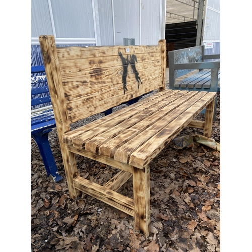 2010 - A WOODEN SLATTED GARDEN BENCH WITH PAINTED HARE BACKGROUND