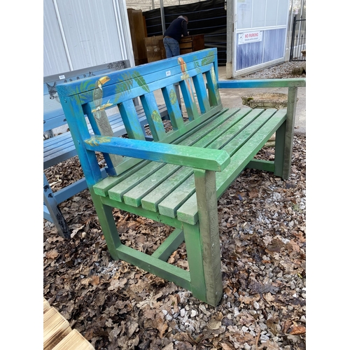 2013 - A WOODEN SLATTED GARDEN BENCH WITH PAINTED PARROT DETAIL