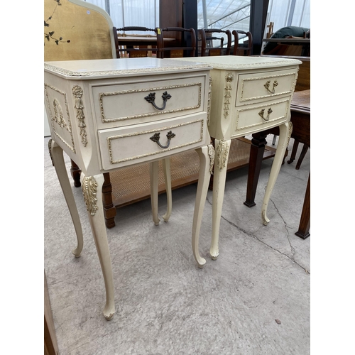 2783 - A PAIR OF CREAM AND GILT BEDSIDE CHESTS ON CABRIOLE LEGS, WITH TWO DRAWERS