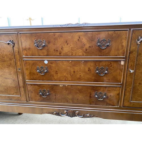 2791 - A MID 20TH CENTURY WALNUT SIDEBOARD WITH RAISED BACK ON CABRIOLE LEGS, ENCLOSING THREE DRAWERS AND T... 