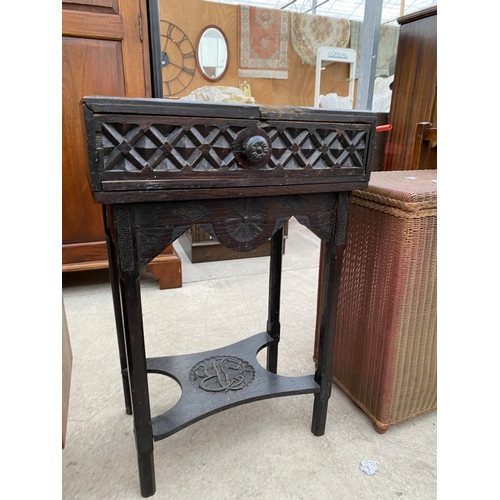 2807 - A VICTORIAN EBONISED OAK SIDE TABLE, THE TOP PROFUSELY CARVED WITH FLOWERS COMPLETE WITH SINGLE DRAW... 