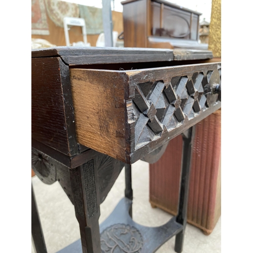 2807 - A VICTORIAN EBONISED OAK SIDE TABLE, THE TOP PROFUSELY CARVED WITH FLOWERS COMPLETE WITH SINGLE DRAW... 