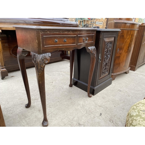 2809 - A VICTORIAN POT CUPBOARD WITH PROFUSELY CARVED DOOR AND A SERPENTINE FRONT TWO DRAWER SIDE-TABLE ON ... 