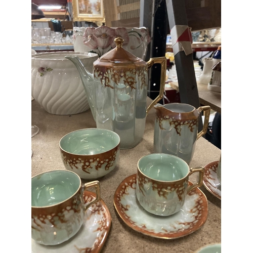 1131 - A VINTAGE CHINA COFFEE SET IN A GREEN LUSTRE WITH COPPER COLOURED DECORATION TO INCLUDE A COFFEE POT... 