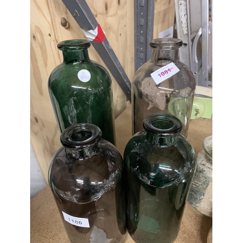 1186 - FOUR COLOURED GLASS BOTTLES