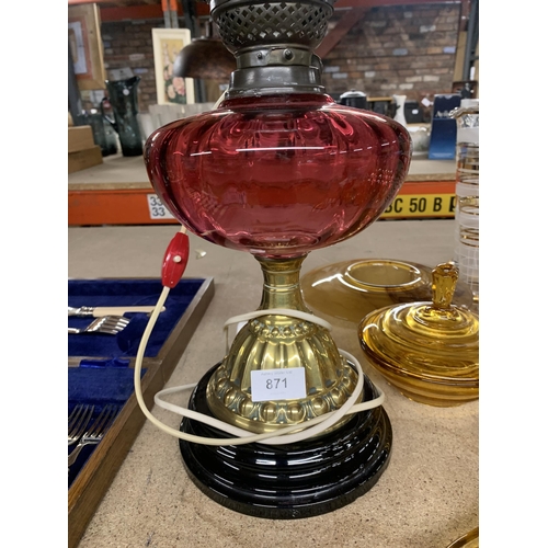 871 - A CONVERTED OIL LAMP WITH BRASS BASE, CRANBERRY GLASS RESERVOIR, GLASS SHAD AND FUNNEL