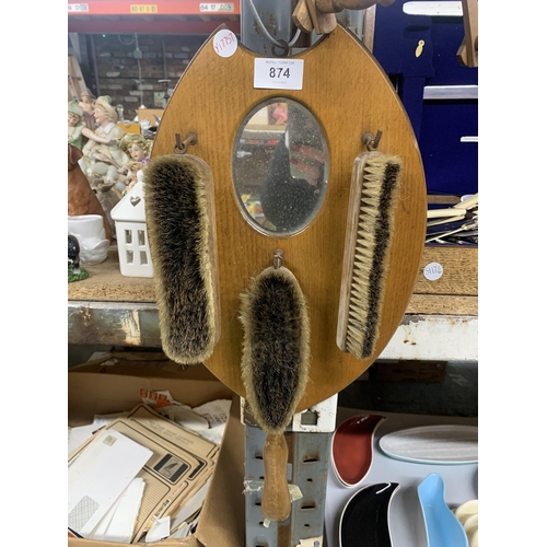 874 - A VINTAGE FOLDING COAT/HAT RACK AND A MIRROR WITH THREE BRUSHES