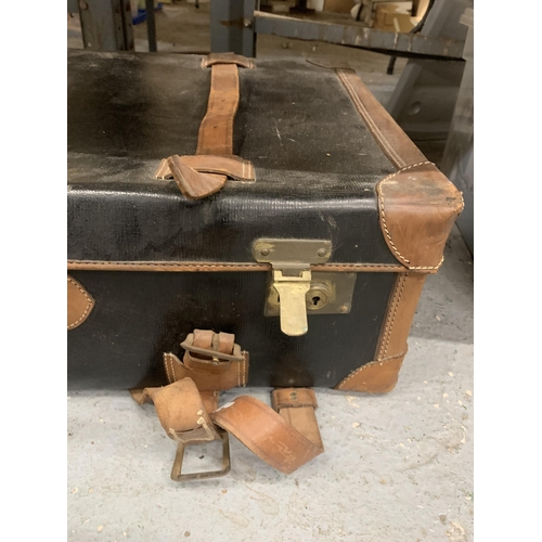 888 - A VINTAGE CANVAS AND LEATHER SUITCASE