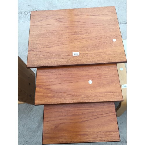 2833 - A RETRO TEAK NEST OF THREE TABLES