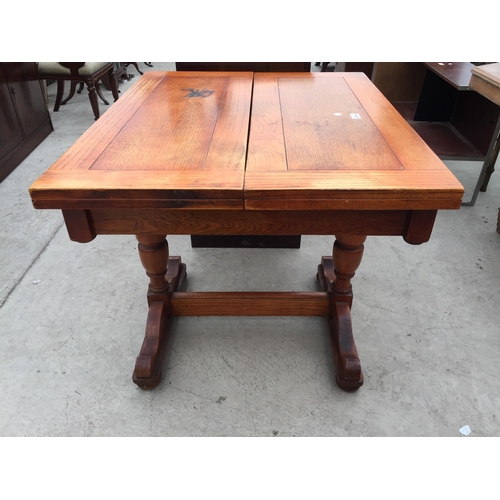 2839A - AN EARLY 20TH CENTURY OAK FOLD-OVER PASTRY TABLE