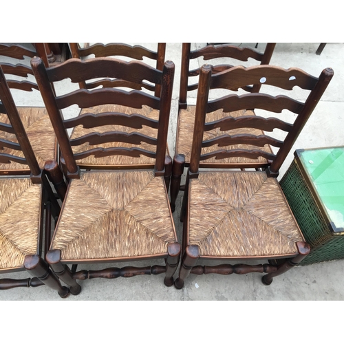 2846 - A SET OF SIX LANCASHIRE STYLE LADDERBACK DINING CHAIRS WITH RUSH SEATS