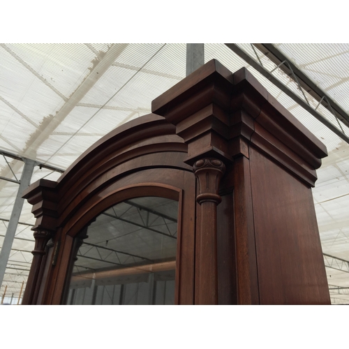 2850 - A VICTORIAN MAHOGANY CYLINDER BUREAU BOOKCASE WITH SINGLE ARCHED GLAZED UPPER PORTION, THE BASE ENCL... 